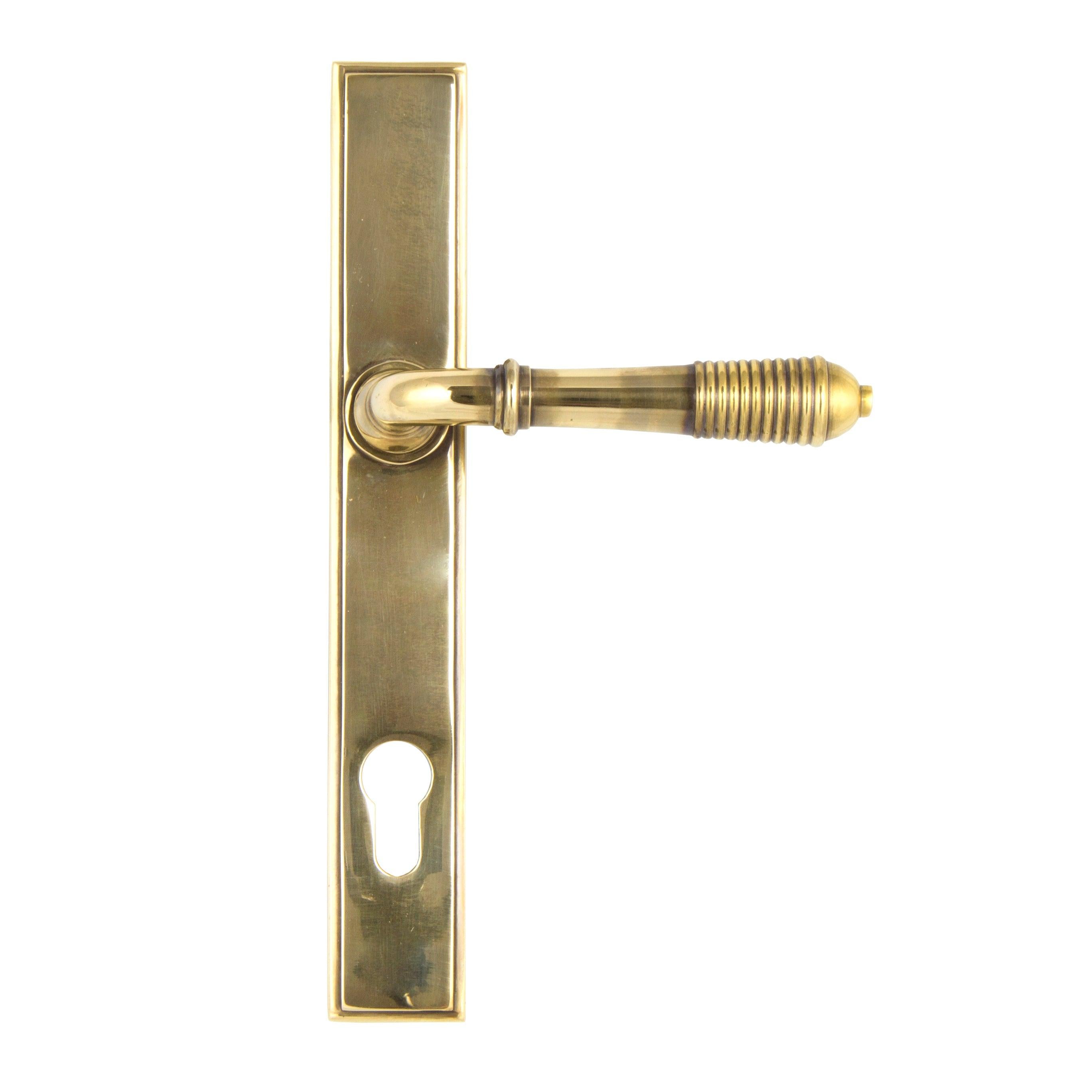 From The Anvil's Aged Brass Reeded Slimline Lever Espag. Lock Set