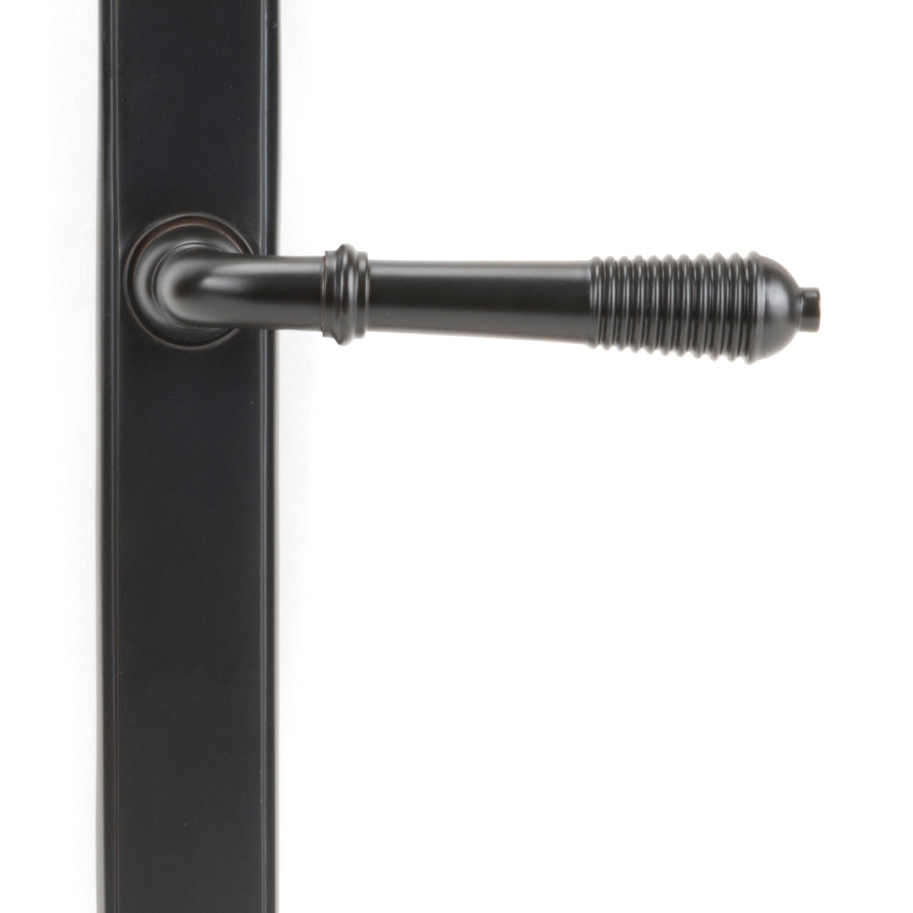 From The Anvil's Aged Bronze Reeded Slimline Lever Espag. Latch Set