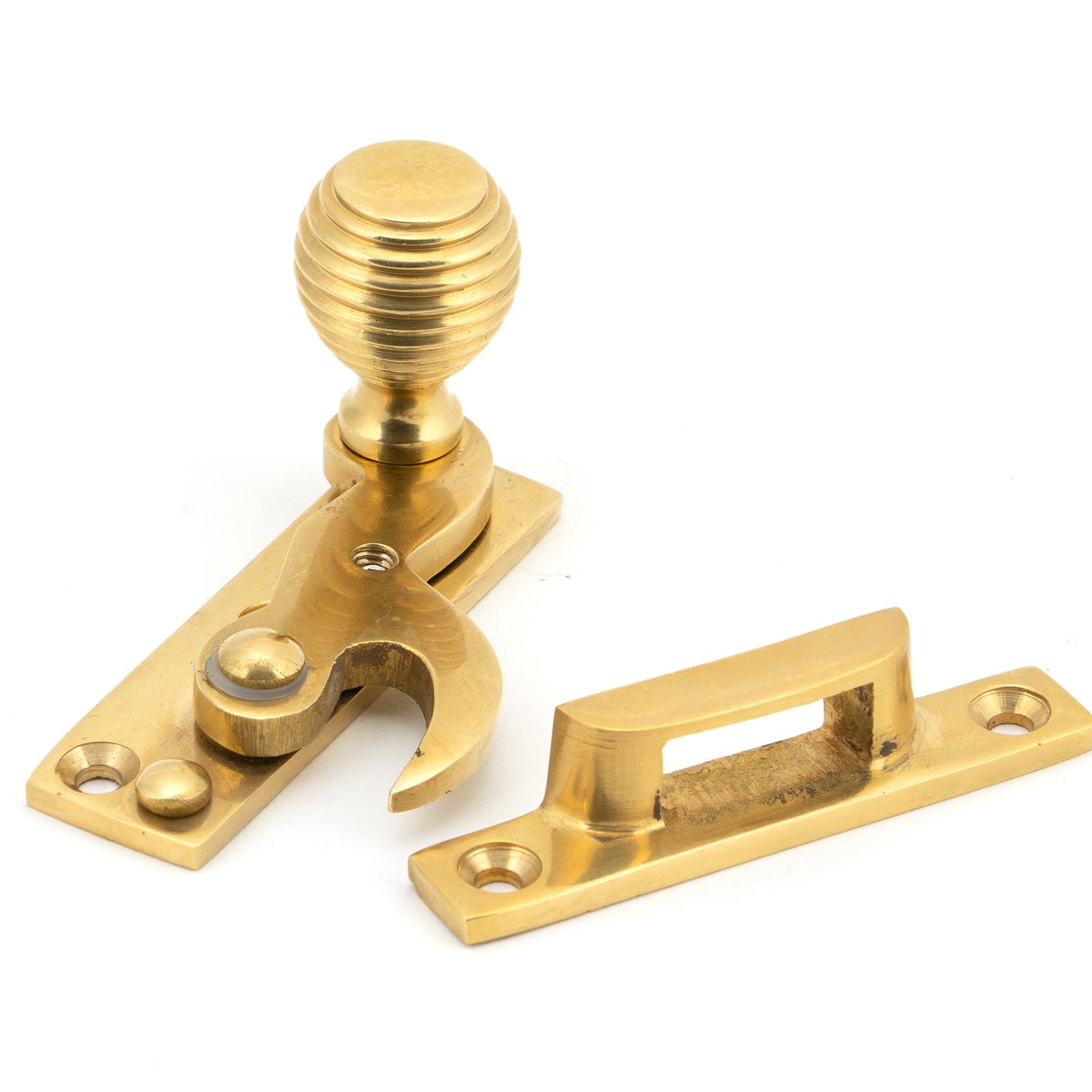 From The Anvil's Polished Brass Beehive Sash Hook Fastener