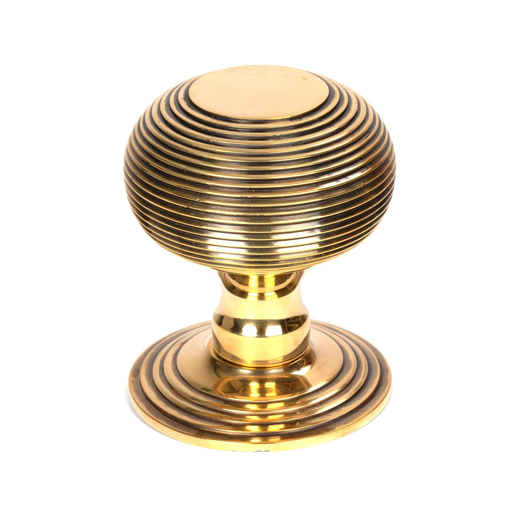 From The Anvil's Aged Brass Beehive Centre Door Knob