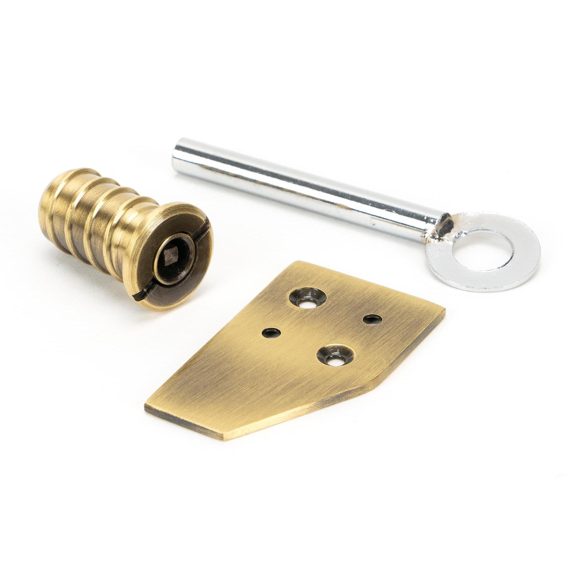 From The Anvil's Aged Brass Key-Flush Sash Stop