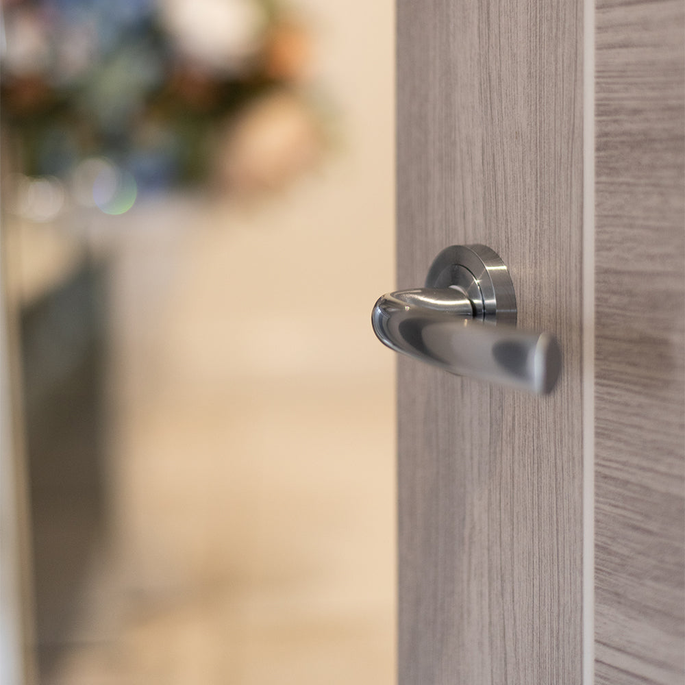 STATUS Nevada Lever Door Handle on Round Rose