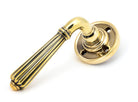 From The Anvil's Aged Brass Hinton Lever on Rose Set (Sprung)