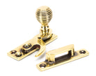 From The Anvil's Aged Brass Beehive Sash Hook Fastener