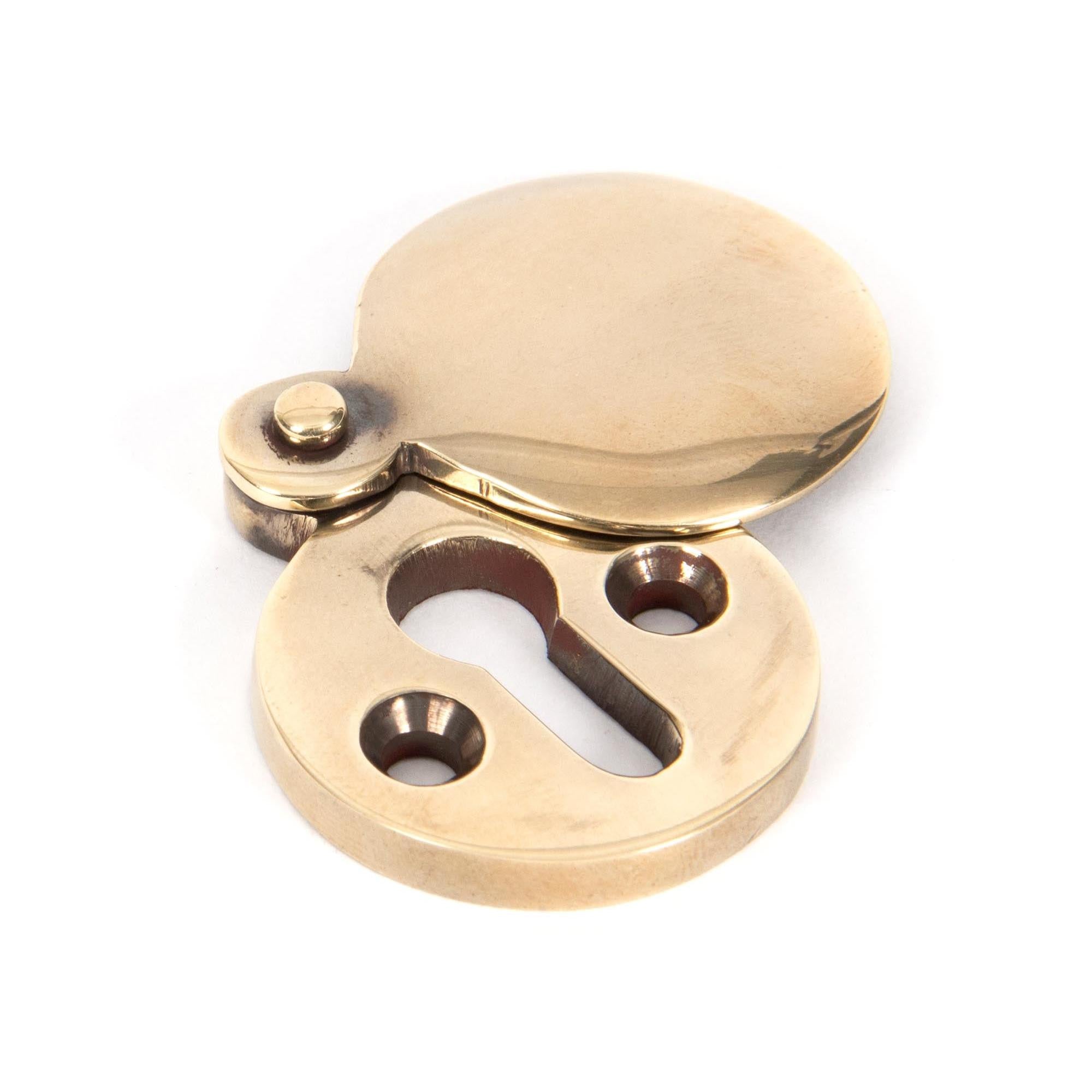 From The Anvil's Aged Brass 30mm Round Escutcheon