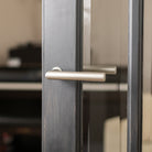 Forme Elle Lever Door Handle on Concealed Round Rose