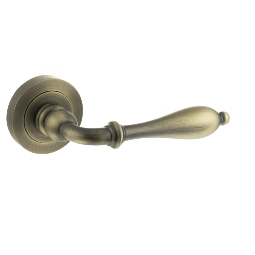 Old English Wrexham Lever Door Handle on Round Rose - Matt Antique Brass